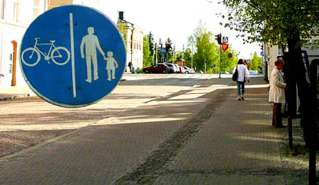 Rough textured paving dividing pedestrian and cycle paths in Oulu, Finland