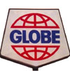 1970s Globe logo with red globe outline and blue text, in pentagon