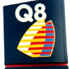 Q8 logo, 1990s version. Yellow/red/blue striped sails on dark blue background