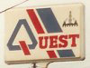 Quest logo with oil rig and blue and red diagonal stripes